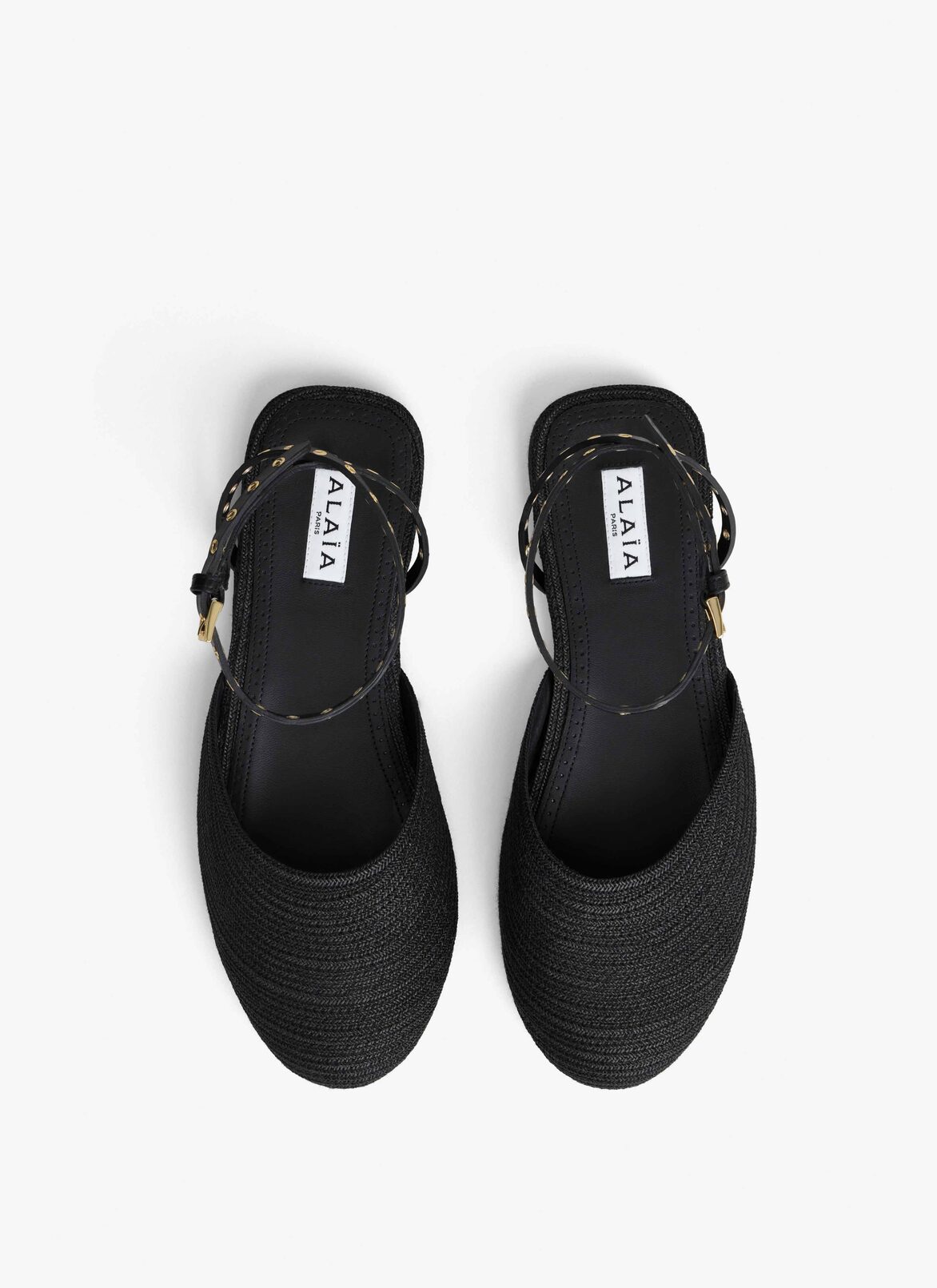FLAT SANDALS IN PAPER STRAW ALAÏA BLACK FLAT SANDALS IN PAPER STRAW